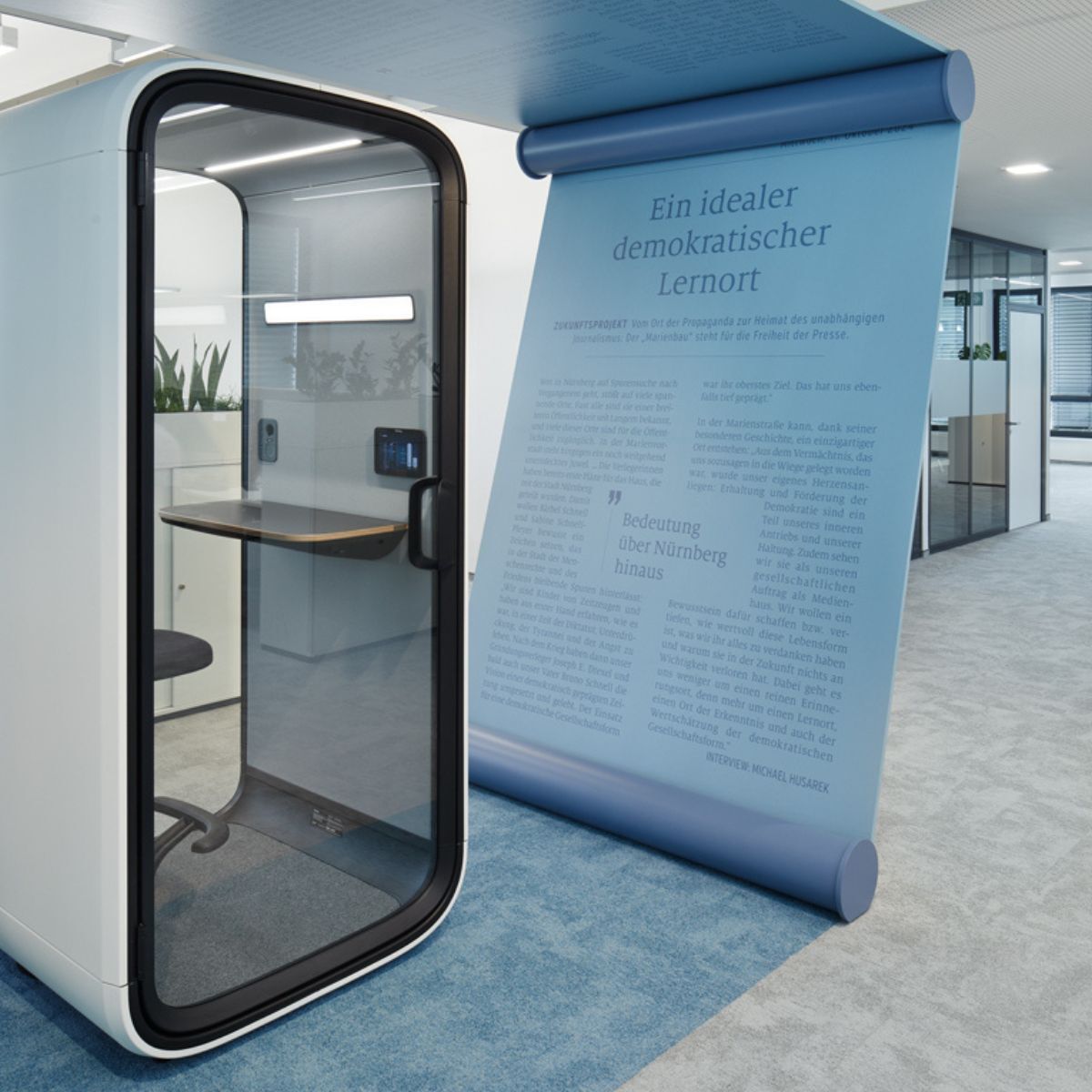 Telefonkabine, die von individuellen Gestaltungselement beim Verlag Nürnberger Presse umgeben ist, geplant und eingerichtet von designfunktion